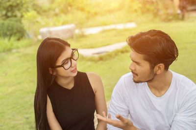 Young couple looking away