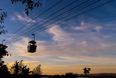 Low angle view of overhead cable car against sky in seaworld in san diego 