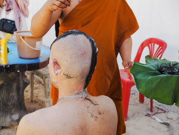 Barber shaving head of man