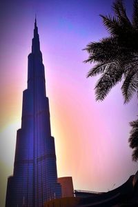 Low angle view of buildings against sky during sunset