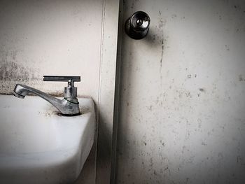 Close-up of faucet in bathroom