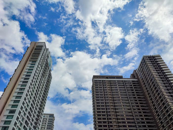 Low angle view of modern buildings against sky