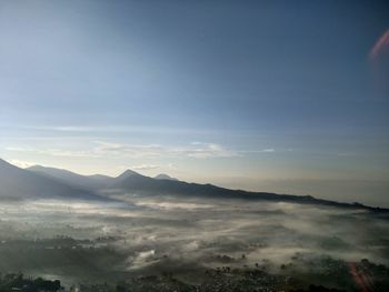 Scenic view of mountains against sky during sunset