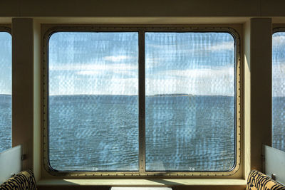 View of sea through train window