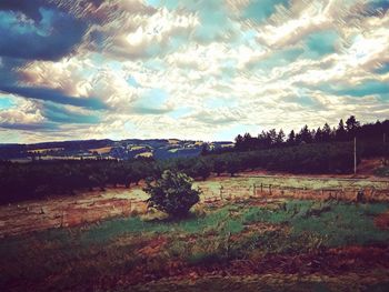 View of landscape against cloudy sky