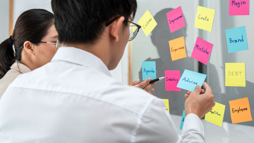 Side view of doctor working at office