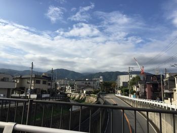 Buildings in city against sky