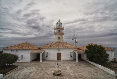 Exterior of lighthouse against sky