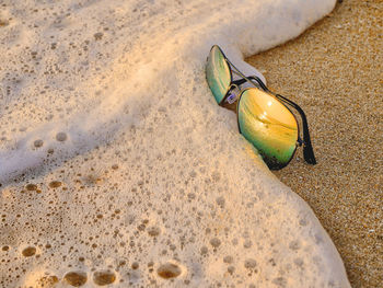 High angle view of shoes on sand