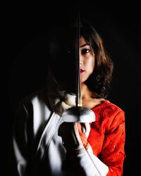 Dual personality of sportswoman in fencing