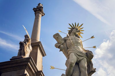 Low angle view of statue against sky