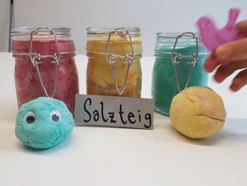 Close-up of ice cream in glass jar on table