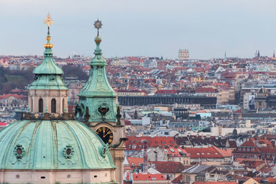 Cathedral by buildings in city