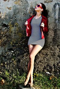 Rear view of young woman standing outdoors