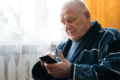 Young man using mobile phone