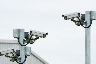 Cctv security camera video system for safety installed outside the warehouse of factory building. 