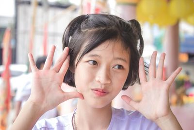 Portrait of cute girl smile with hand and innocent in the countryside