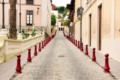 View of narrow pathway along built structures