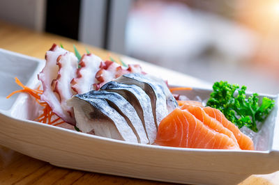 Close-up of fish served in plate on table