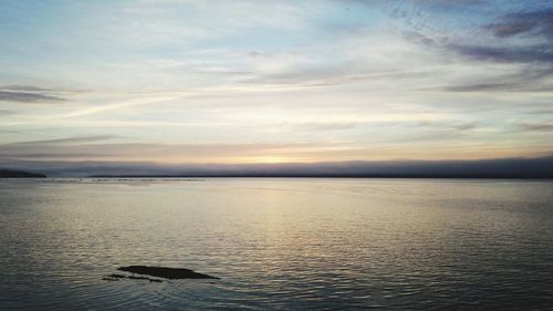 Scenic view of calm sea at sunset