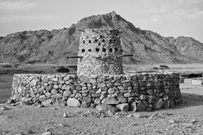 Old fountain with stone walls in the egyptian desert