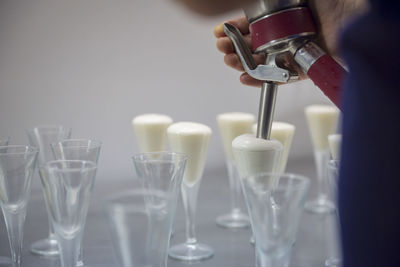 Close-up of wine glasses on table