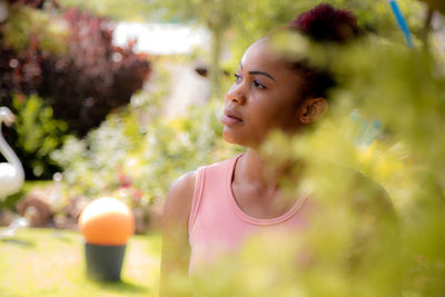 Portrait of beautiful young woman looking away