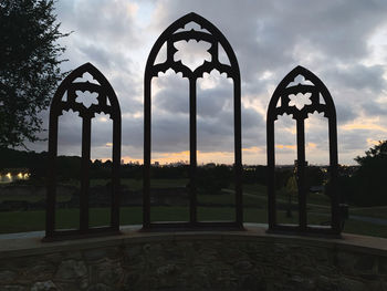 Silhouette of park against sky during sunset