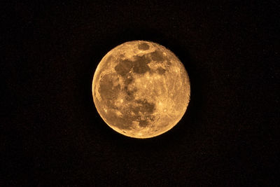 Low angle view of moon against sky at night