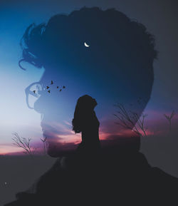 Silhouette woman standing against blue sky during sunset