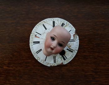 Close-up of clock on table