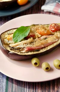 Eggplant baked in the oven with prosciutto cotto and parmesan cheese and olive