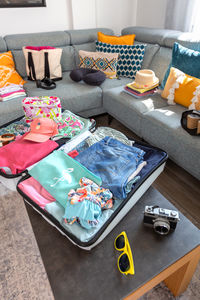 High angle view of people sitting on sofa at home