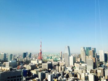 Low angle view of cityscape against clear sky