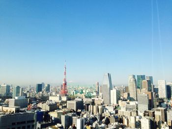 Low angle view of cityscape against clear sky