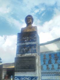 Low angle view of statue against sky