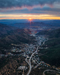 Aerial view of townscape against sky during sunset