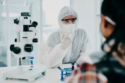 Portrait of scientist examining chemical in laboratory