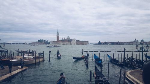 Boats moored at harbor