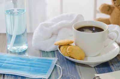 Close-up of cookies and coffee on table