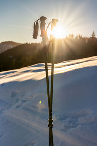 Scenic view of snow field against sky during sunset