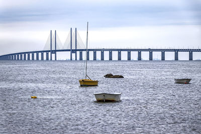 Bridge over sea against sky