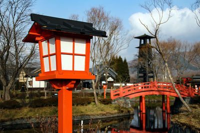 Red bell tower against sky