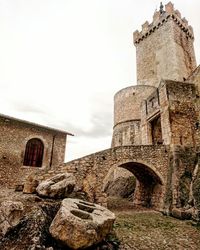 Low angle view of old ruin against sky