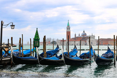 Boats moored in canal