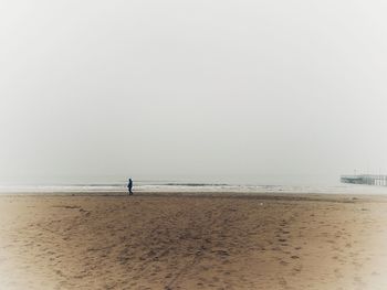 Scenic view of beach against clear sky