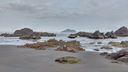 Scenic view of beach against sky