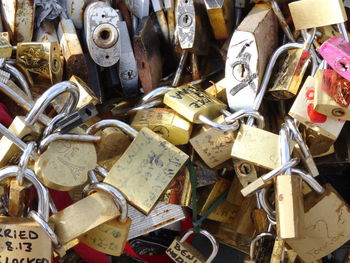 Close-up of padlocks hanging on railing