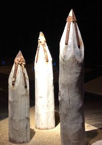 Close-up of clothes hanging in the dark