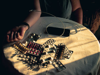 High angle view of woman holding hands on table